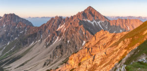 View of the Reither Spitze (2374 m) in the Karwendel Mountains shortly after sunrise. View of the Reither Spitze (2374 m) in the Karwendel Mountains shortly after sunrise.