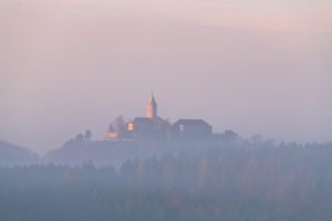 Sunrise over the Leuchtenburg with fog over the Saale valley. Sunrise over the Leuchtenburg with fog over the Saale valley.