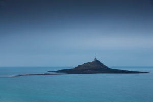 The tidal island of Ilot St. Michel at high tide on a misty autumn day The tidal island of Ilot St. Michel at high tide on a misty autumn day