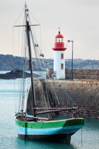 Morning mood at the lighthouse of Eruqy - harbor entrance with boats. Brittany France Morning mood at the lighthouse of Eruqy - harbor entrance with boats. Brittany France