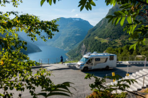 Mobile home, parking lot, Geiranger fjord Norway