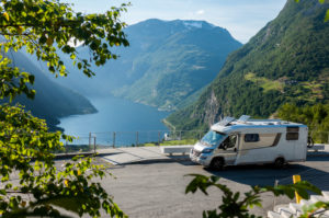 Mobile home, parking lot, Geiranger fjord Norway