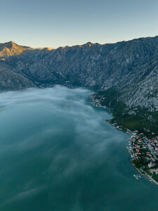 Bay of Kotor, Perast in Montenegro on the Adriatic Sea, sunrise in the morning mist on the water