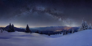 Milky way above the Karwendel, in the foreground the snowy alpine meadow of the Wallgau Alm with powder snow on the trees, the illuminated places are Krün and Mittenwald, mountains: Simetsberg, Benediktenwand, Karwendel mountains, Arnspitze Milky way above the Karwendel, in the foreground the snowy alpine meadow of the Wallgau Alm with powder snow on the trees, the illuminated places are Krün and Mittenwald, mountains: Simetsberg, Benediktenwand, Karwendel mountains, Arnspitze