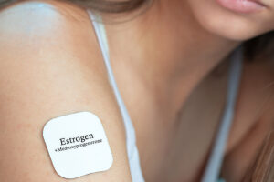 Estrogen and medroxyprogesterone transdermal patch, conceptual image. 