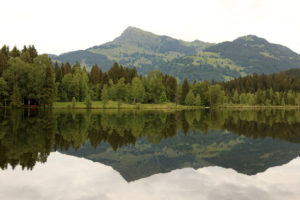Reflections from the Kitzbüheler Horn in the Schwarzsee near Kitzbühel in Tyrol Reflections from the Kitzbüheler Horn in the Schwarzsee near Kitzbühel in Tyrol