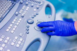 Docotr using a computer-Heart valve replacement surgery, operating room,
