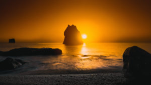 Sunset over rock formations, Reynisfjara beach, South Coast, Iceland Sunset over rock formations, Reynisfjara beach, South Coast, Iceland