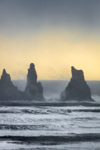 Basalt Sea Stacks and waves at Reynisfjara Beach located by Vik in Myrdal, South Coast of Iceland. Icelandic folklore states that these stacks are thought to be trolls. Basalt Sea Stacks and waves at Reynisfjara Beach located by Vik in Myrdal, South Coast of Iceland. Icelandic folklore states that these stacks are thought to be trolls.