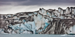 Ice walls- Jokulsarlon Glacial Lagoon, Breidarmerkurjokull Glacier, Vatnajokull Ice Cap, Iceland Ash seen in the ice due to volcanic eruptions from Grimsvotn. Ice walls- Jokulsarlon Glacial Lagoon, Breidarmerkurjokull Glacier, Vatnajokull Ice Cap, Iceland Ash seen in the ice due to volcanic eruptions from Grimsvotn.