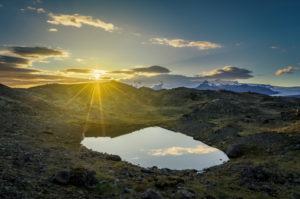 Lava and moss landscape with sunset, Svinafellsjokull Glacier in the background, Iceland