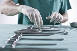 Op. doctor, gloves, instruments, prepare, check, medium close-up, detail, Op. doctor, gloves, instruments, prepare, check, medium close-up, detail,