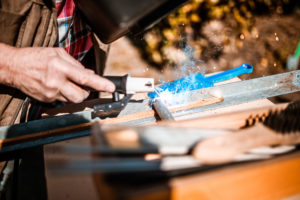 Arc welding on a workpiece with flying sparks, hobby craftsmen Arc welding on a workpiece with flying sparks, hobby craftsmen