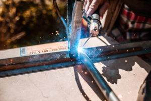 Arc welding on a workpiece with flying sparks, hobby craftsmen Arc welding on a workpiece with flying sparks, hobby craftsmen
