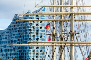 Masts from the sailing ship Rickmer Rickmers, in the background the Elbphilharmonie, Hamburg. Masts from the sailing ship Rickmer Rickmers, in the background the Elbphilharmonie, Hamburg.
