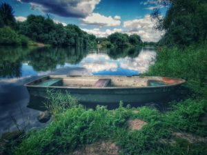 old broken boat on the Saale old broken boat on the Saale
