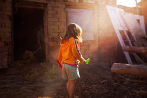 4-6 years old child playing in old shed, 4-6 years old child playing in old shed,