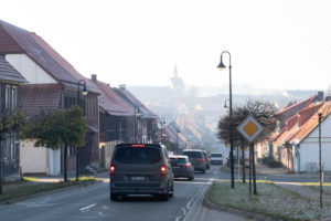 Germany, Saxony-Anhalt, Hasselfelde, transit road, parish church in the background, Oberharz am Brocken.