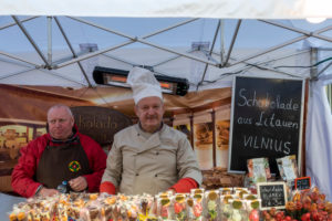 Germany, Saxony-Anhalt, Wernigerode, two men, chocolate manufacturer from Vilnus, Lithuania, guests at the Chocolate Festival Wernigerode, Harz.