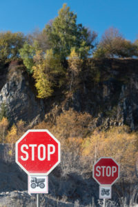 Germany, Saxony-Anhalt, Upper Harz, two stop signs, Kalkwerk Cold Valley, Elbingerode, Harz.