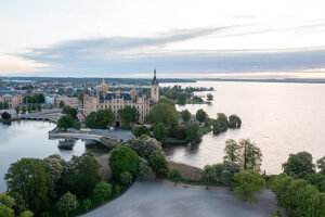 Schwerin Castle, situated on an island, surrounded by water, soft morning light, Schwerin, Mecklenburg-Vorpommern, Germany