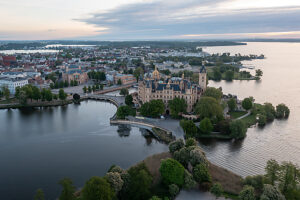 Schwerin Castle, situated on an island, surrounded by water, soft morning light, Schwerin, Mecklenburg-Vorpommern, Germany