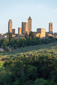 San Gimignano, one of the most impressive towns in Tuscany in Italy, rises above the surrounding hills and olive groves with its famous medieval towers, San Gimignano, Tuscany, Italy