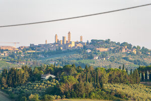 San Gimignano, one of the most impressive towns in Tuscany in Italy, rises above the surrounding hills and olive groves with its famous medieval towers, San Gimignano, Tuscany, Italy