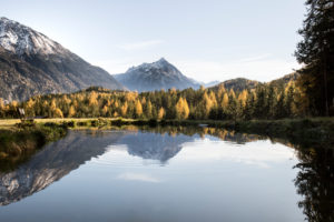 A lake with a mirror-smooth surface in the Tyrolean Alps A lake with a mirror-smooth surface in the Tyrolean Alps