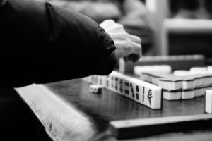 Man playing on the roadside in Nanjing Mahjong