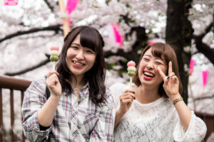 Two Japanese women beeing happy having a snack