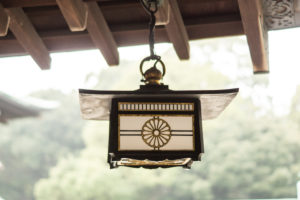 A hanging oil lamp in a temple complex in Tokyo