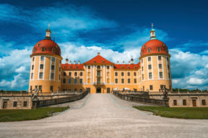 Castle Moritzburg located in Germany, Saxony region, near Dresden. Beautiful spring day with blue sky and white clouds. Surrounded by beautiful park. Castle Moritzburg located in Germany, Saxony region, near Dresden. Beautiful spring day with blue sky and white clouds. Surrounded by beautiful park.
