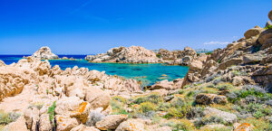 Rocks around azure sea water, costline of Maddalena island, Sardinia, Italy.