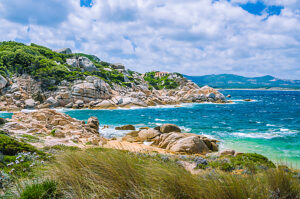 Windy costline with granite rocks near Costa Serena, Sardinia, Italy.