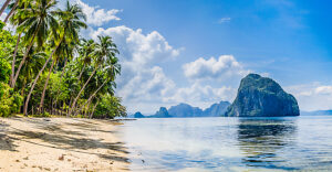 Landscape of El Nido. Sandy Beach with Huge Rock, Palawan island. Philippines.