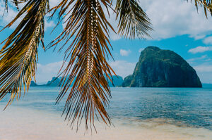Huge Rock of Pinagbuyutan Island in blue ocean. Landscape of El Nido. Palawan island. Philippines.