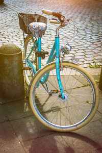 Cool vintage blue bycicle parked in central city hamburg.