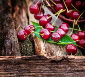 Red cherries on wood Red cherries on wood
