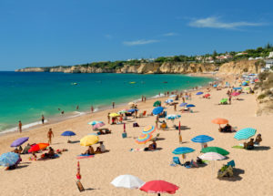 Armacao de Pera beach with sunshades in Spring Armacao de Pera beach with sunshades in Spring