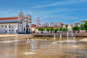 Portugal; Algarve; Lagos; the water feature fountains in the Praca do Infante Dom Henrique square and the igreja de Santa Maria de Lagos Portugal; Algarve; Lagos; the water feature fountains in the Praca do Infante Dom Henrique square and the igreja de Santa Maria de Lagos