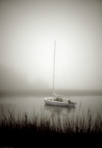 Sailboat anchored in a quiet harbor, Cape Cod, Massachusetts, USA