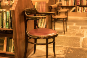 Bookshop interior with chairs in Hay on Wye in Herefordshire, England.