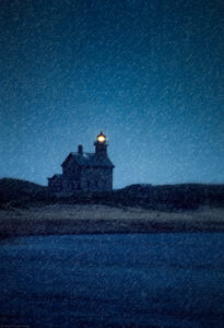 Lighthouse beacon shines on wet and dreary blue day. Block Island, Rhode Island, RI