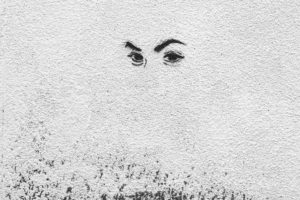 Pair of eyes on white wall Pair of eyes on white wall