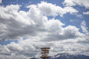 Signpost in front of a mountain panorama. Signpost in front of a mountain panorama.