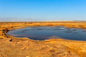 The Gaet'ale pond, also an oil pond, with hypersalin water, Dallol geothermal area, Hamadela, Danakil depression, Afar triangle, Ethiopia The Gaet'ale pond, also an oil pond, with hypersalin water, Dallol geothermal area, Hamadela, Danakil depression, Afar triangle, Ethiopia