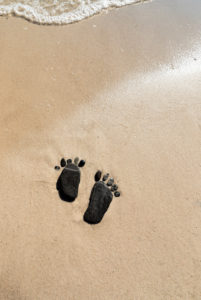 Footprints made of flat stones on the beach, Footprints made of flat stones on the beach,