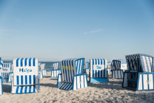 Blue-white striped beach chairs on the island of Rügen, Baltic Sea, with name, Blue-white striped beach chairs on the island of Rügen, Baltic Sea, with name,