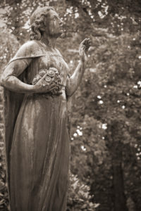 Female statue on cemetery Female statue on cemetery